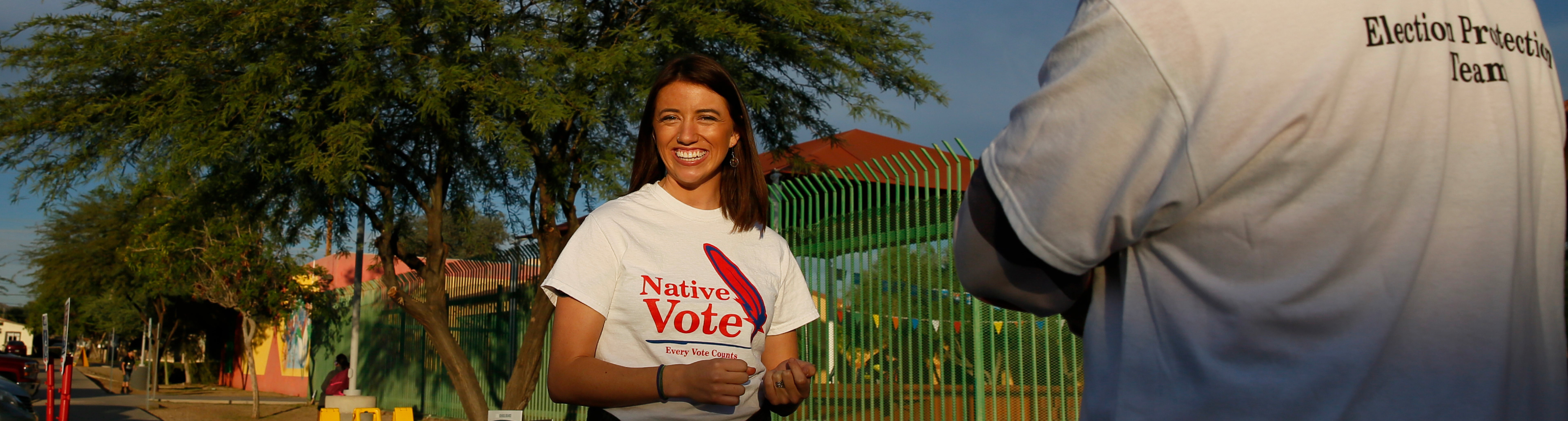 Woman smiling while wearing Native Vote shirt