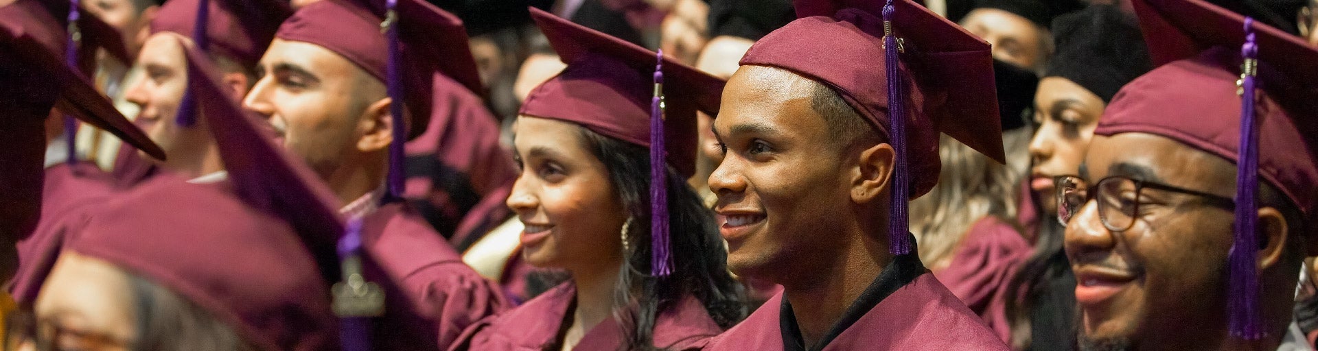 Graduate students sitting at the ASU Law convocation ceremony.