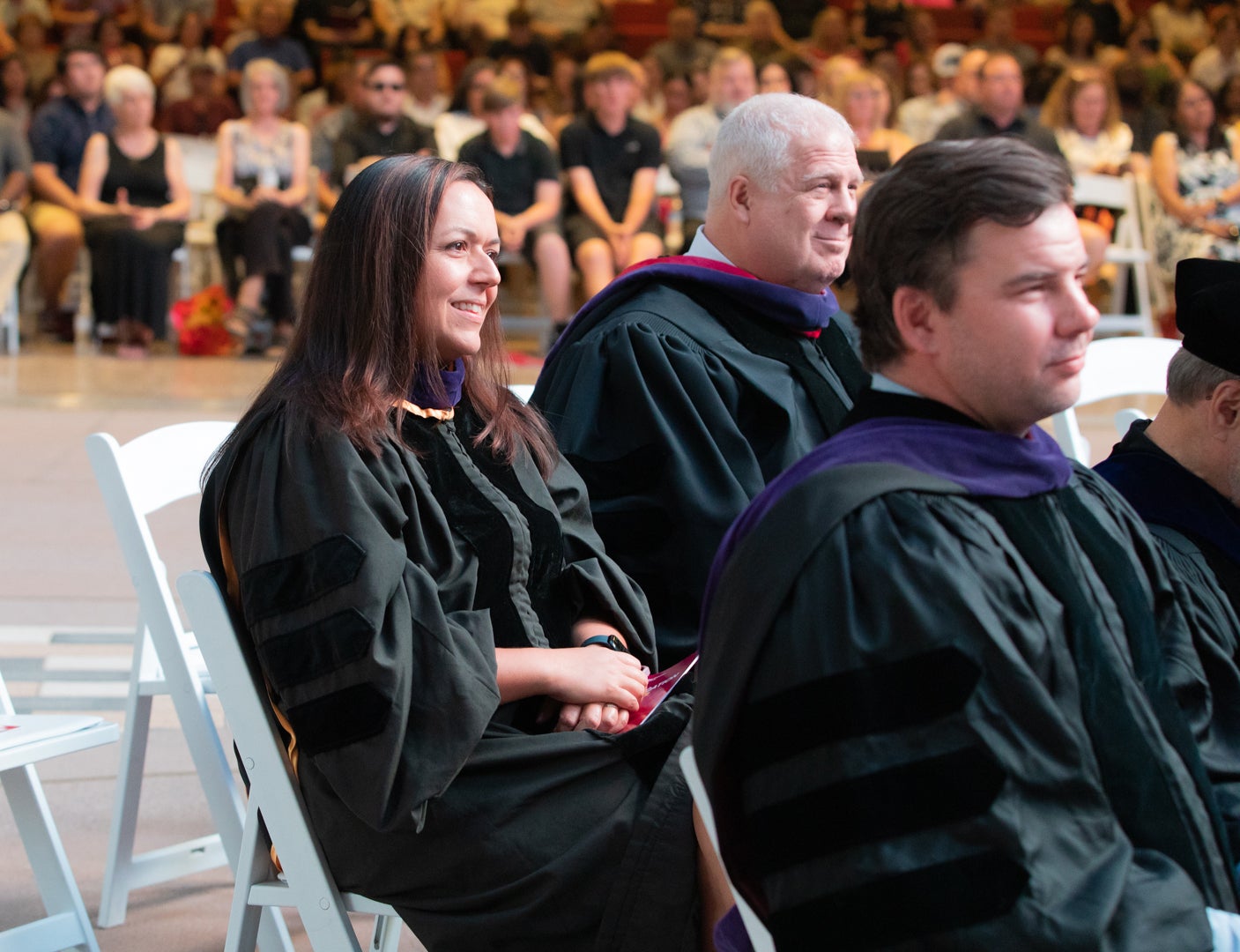 Professor Jennifer Ward sitting in graduation regalia at the ASU Law Fall Convocation ceremony. 