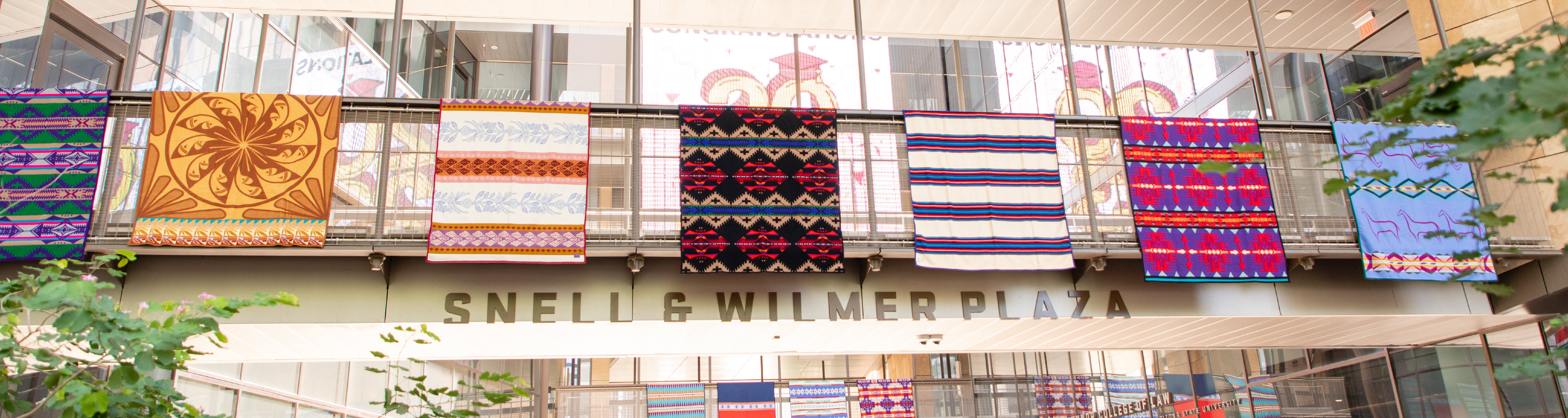 Student's Pendleton Blankets hanging in front of the Beus Center for Law and Society.