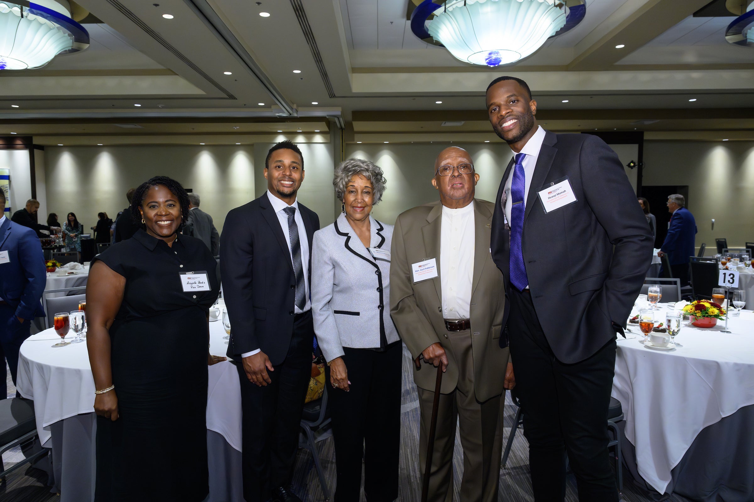 Professor Angela Banks standing with the Honorable Cecil B. Patterson, Dr. Wilma Patterson, and student, Ifeanyi Momah at the 2023 Scholarship Luncheon.