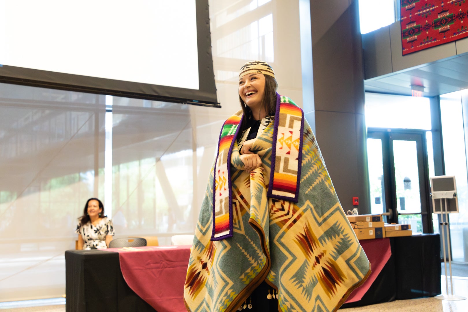 ASU Indian Legal graduate student smiling during the ILP blanket ceremony. 