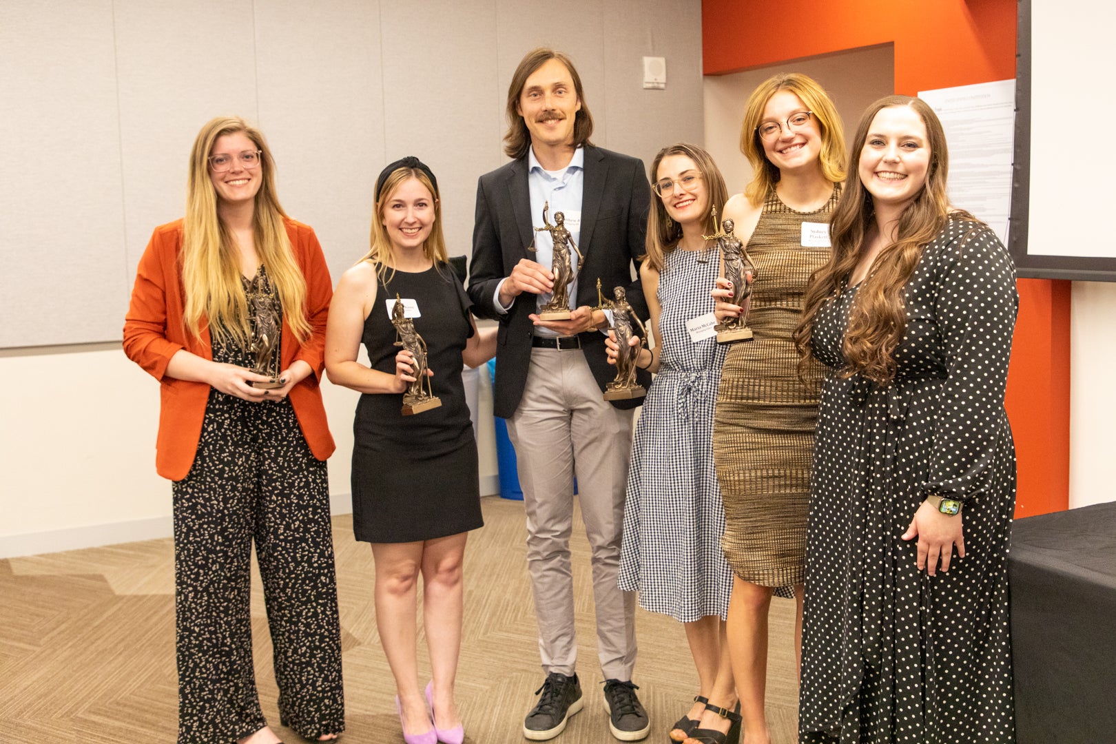 Six Arizona State Law Journal students standing with their awards.