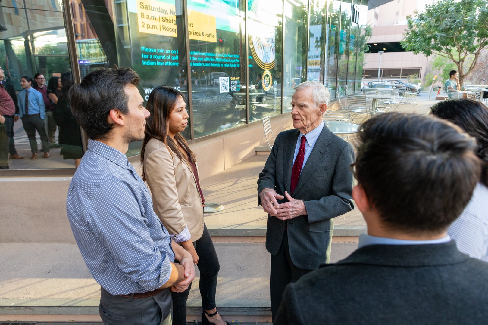 William C. Canby Jr. speaking to ASU Law students outside of the Beus Center for Law and Society building.