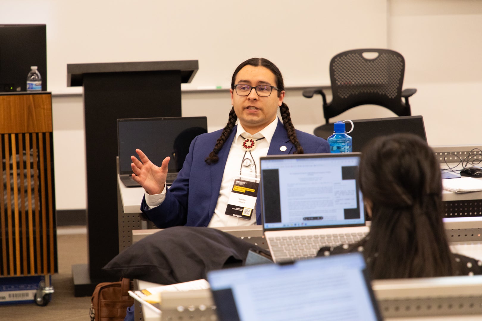 ASU Law student speaking to other students during a convention at ASU.