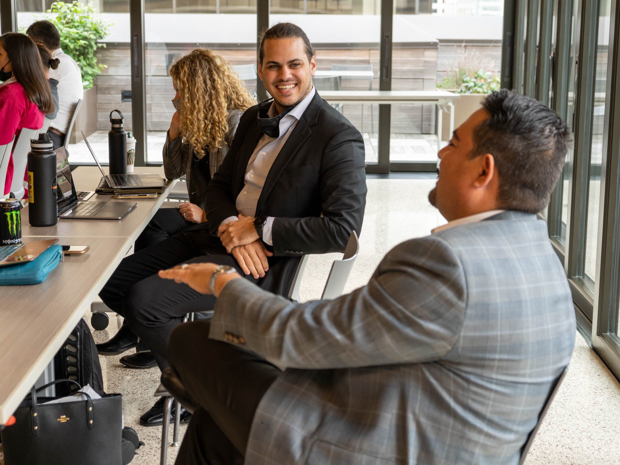 ASU Law students sitting and laughing together while in an ASU Washington, D.C. classroom.