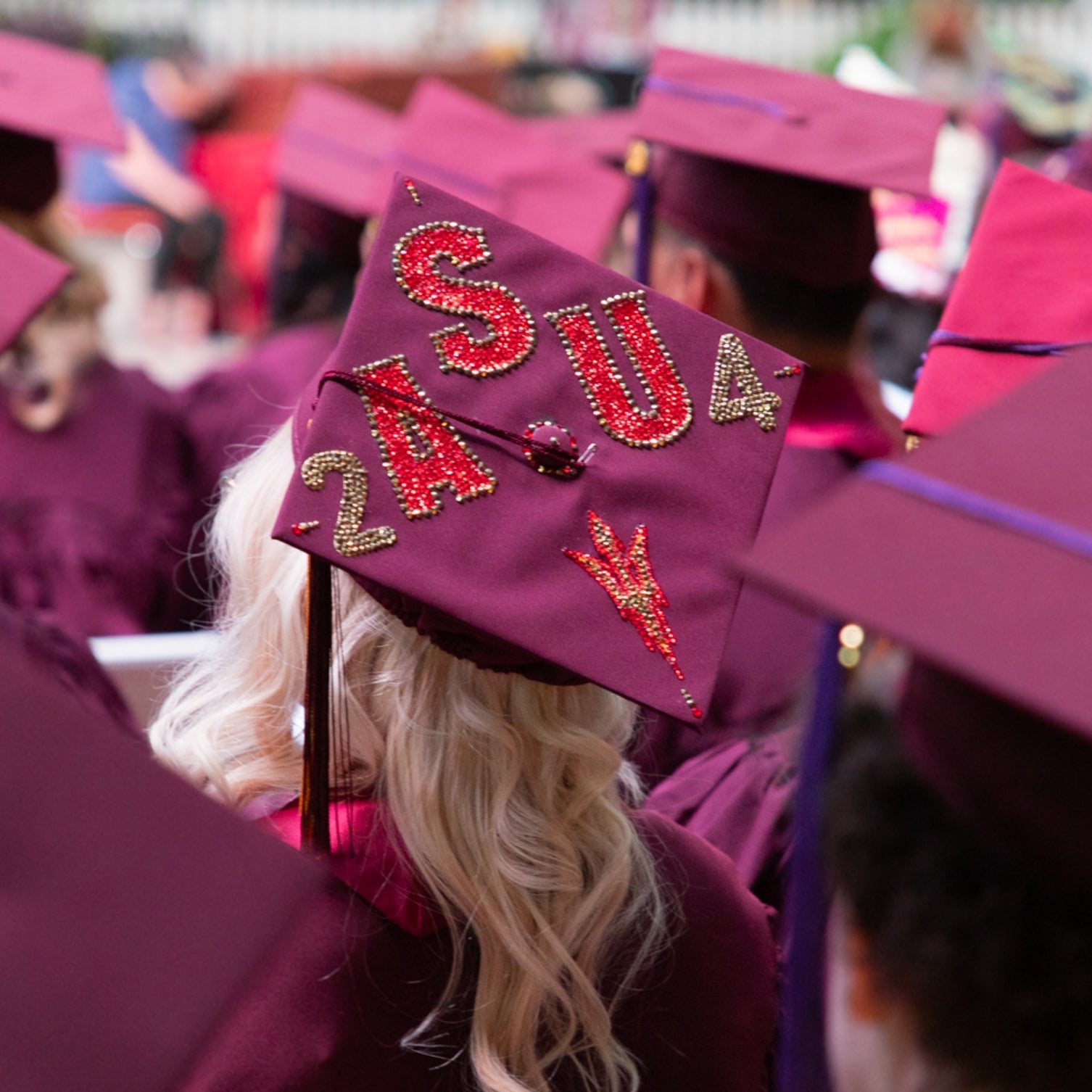 Decorated graduation caps at the Fall 2024 Convocation ceremony