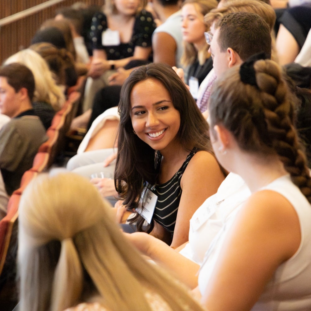 Students conversate in the Armstrong Great Hall