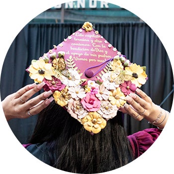 Decorated graduation caps at the Fall 2024 Convocation ceremony