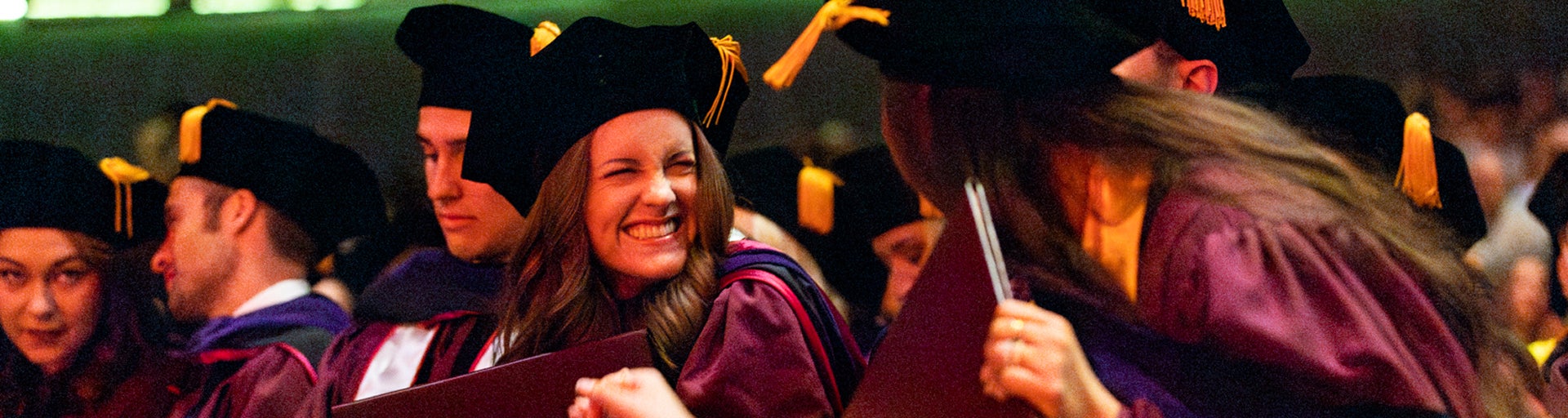 Graduates smile at the Spring 2025 JD and LLM Convocation ceremony