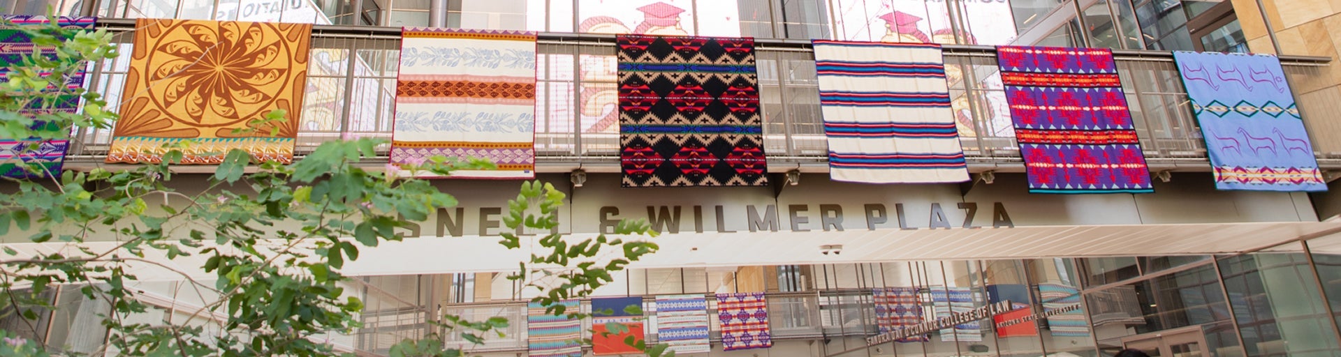 Blankets hanging from the walkways of the Beus Center for Law and Society at the ILP Blanket Ceremony