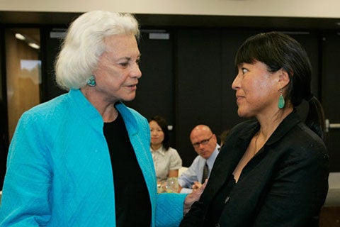 Sandra O'Connor talking to another during the graduate luncheon