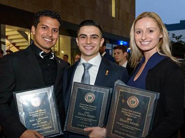 Three students with awards