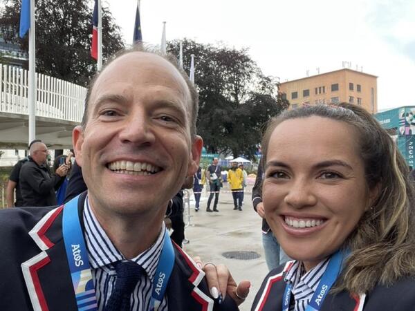 Rocky Harris (left), chef de mission for Team USA at the 2024 Olympic Games, runs into Arizona State University alum and tennis player Desirae Krawczyk at the opening ceremony on July 26. Harris is an ASU alum and the former chief operations officer for Sun Devil Athletics.