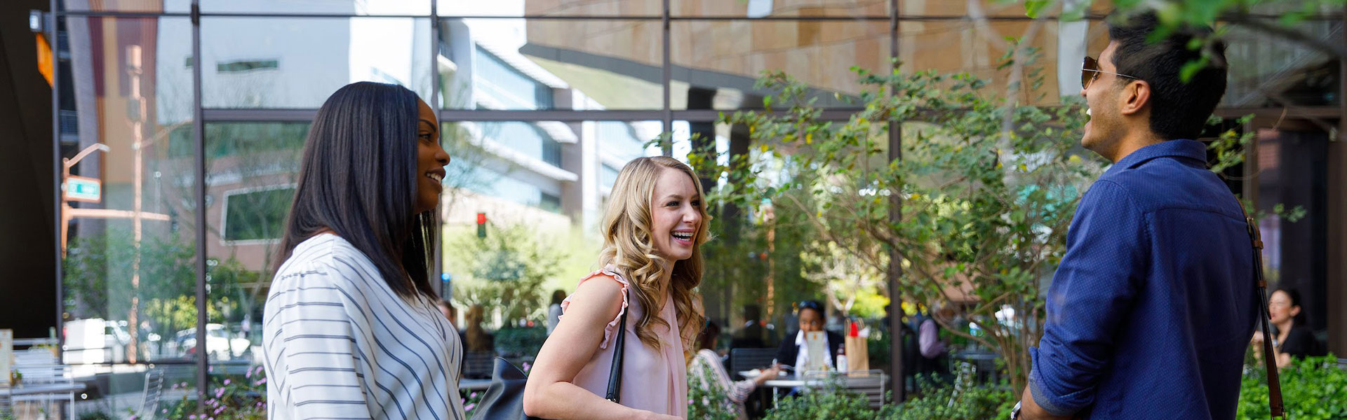 Students conversing in the Beus Center for Law and Society plaza area